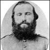 White man with bushy beard in military uniform