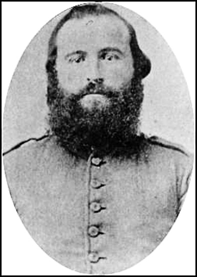 White man with bushy beard in military uniform