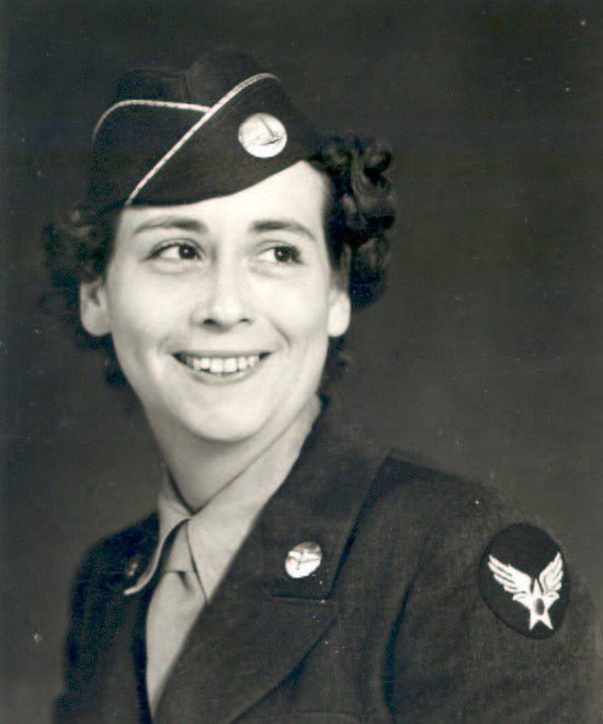 Young white woman smiling in military uniform with cap