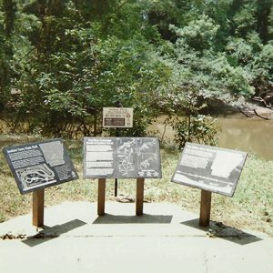 Three interpretation panels and river