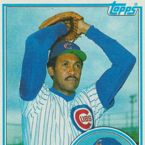 African-American man with mustache in Chicago Cubs baseball uniform throwing a pitch above round portrait and text on card