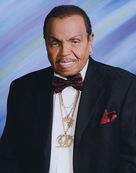 Older African-American man smiling in suit and bow tie