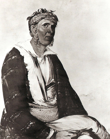 Native American man wearing a headband and robes