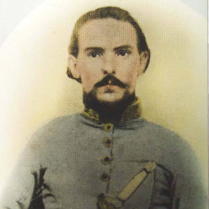 White man with mustache and beard in gray military uniform with sword