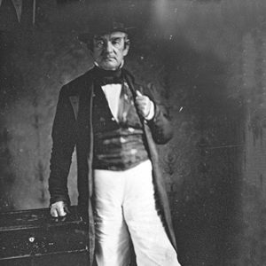 Cherokee man standing in hat and suit