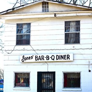 Two-story building with "Jones' Bar-B-Q Diner" sign
