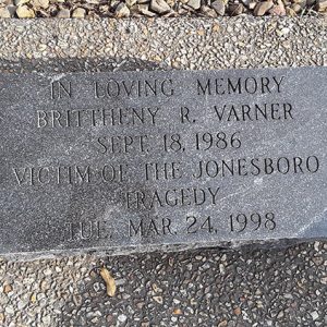 "In loving memory Brittheny R Varner September 18 1986 victim of the Jonesboro tragedy Tuesday Mar 24 1998" engraved stone on trail