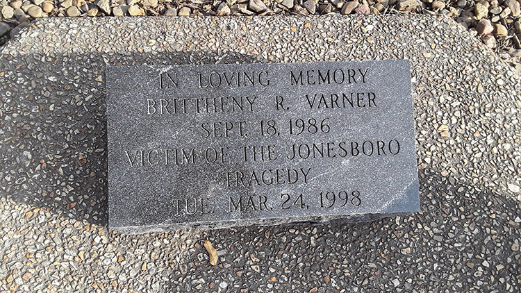 "In loving memory Brittheny R Varner September 18 1986 victim of the Jonesboro tragedy Tuesday Mar 24 1998" engraved stone on trail