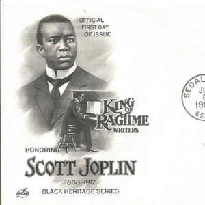 African-American man in suit and playing piano with "Honoring Scott Joplin" text on envelope with stamps