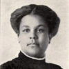 African-American woman with short hair in dress