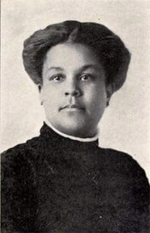 African-American woman with short hair in dress