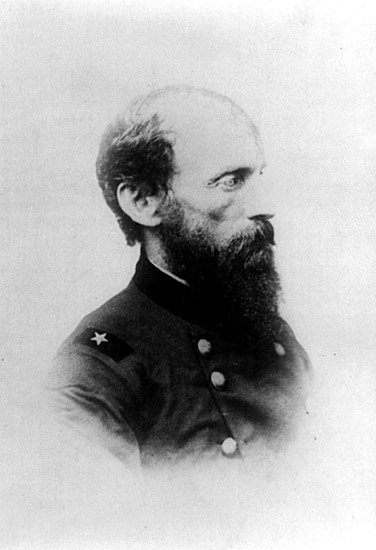 side view of Balding white man with beard in military uniform