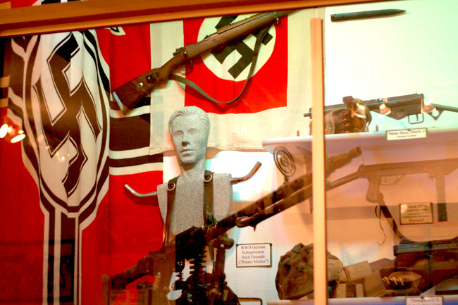 Nazi flags and guns on display