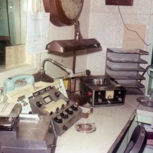 Radio equipment in booth with lamp and microphone