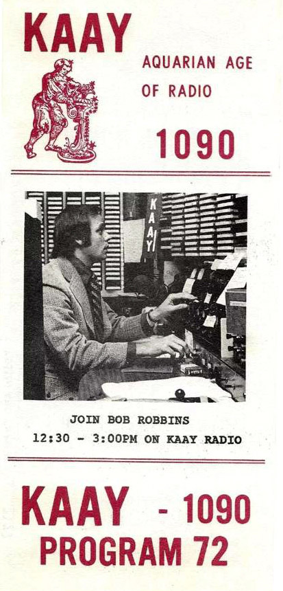 White man using radio equipment on program guide with black and red text