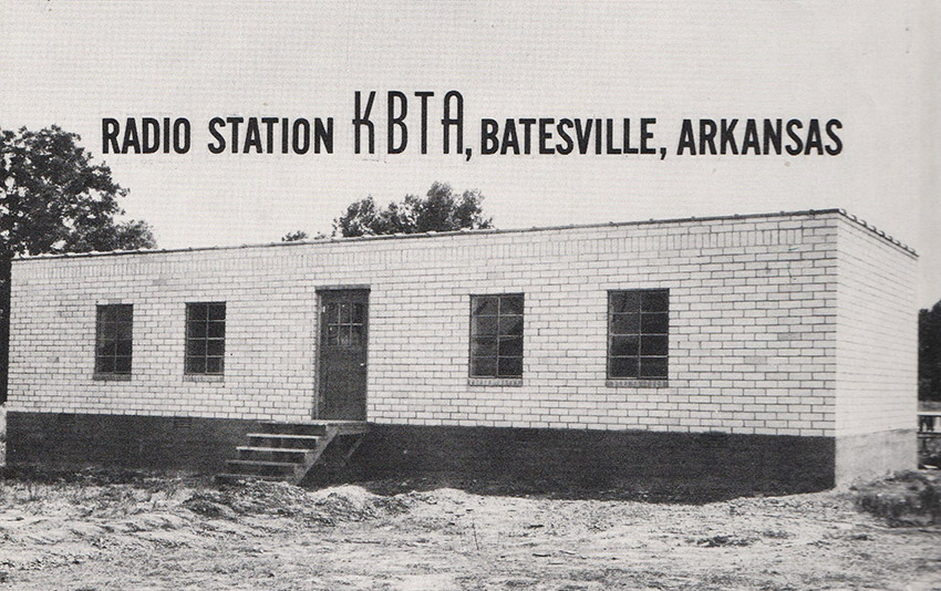 Brick building with flat roof with black text "K.B.T.A."