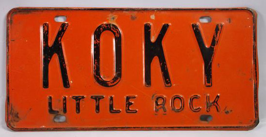 Orange and black "K.O.K.Y. Little Rock" license plate