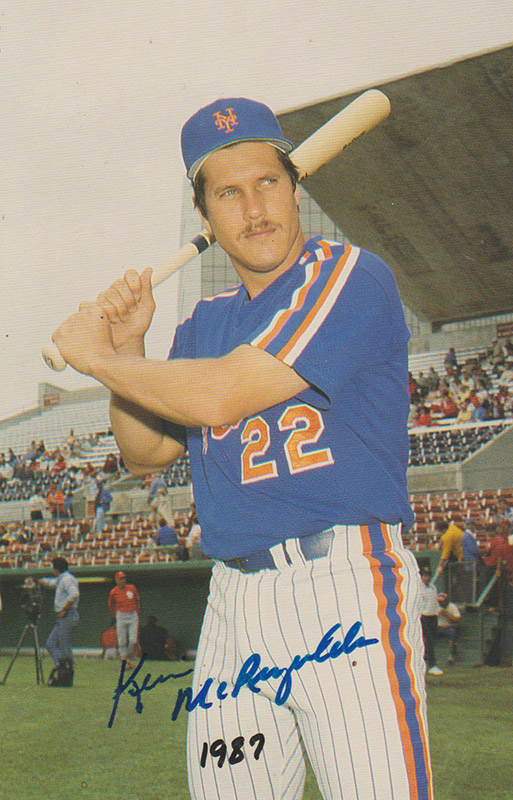 White man in baseball uniform holding bat