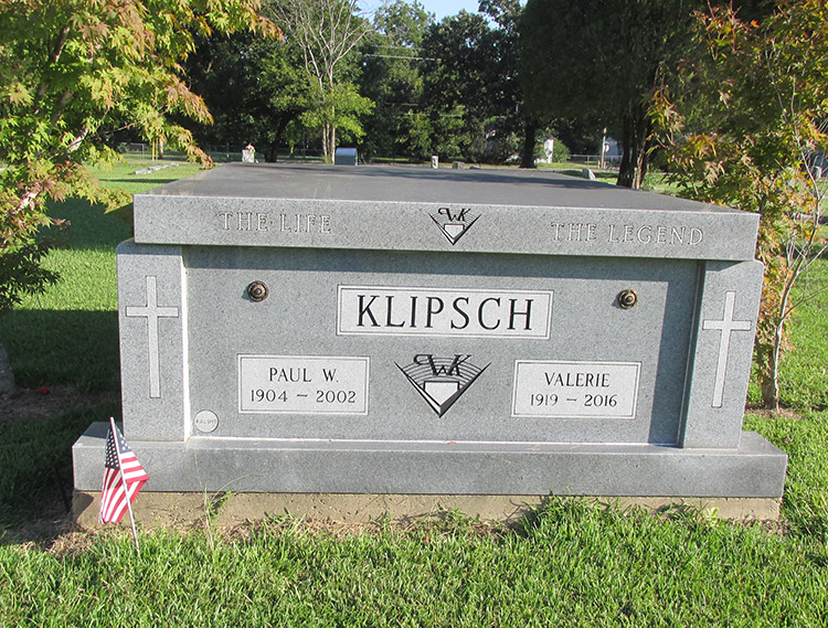"Klipsch" above ground grave site in cemetery