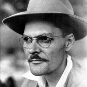White man with a mustache in hat and glasses
