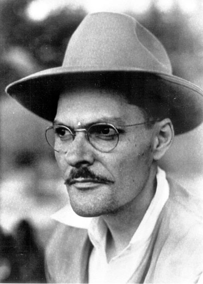White man with a mustache in hat and glasses