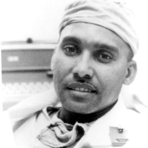African-American doctor wearing scrubs and surgical cap