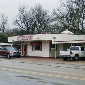 Single-story restaurant with drive-through on two-lane street