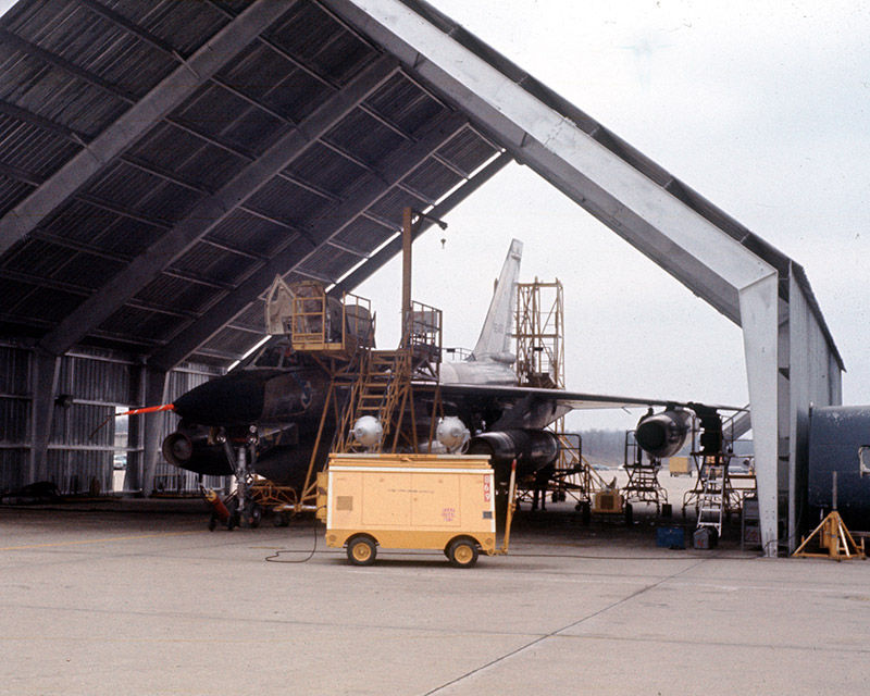 Jet airplane in hangar with repair and diagnostic equipment