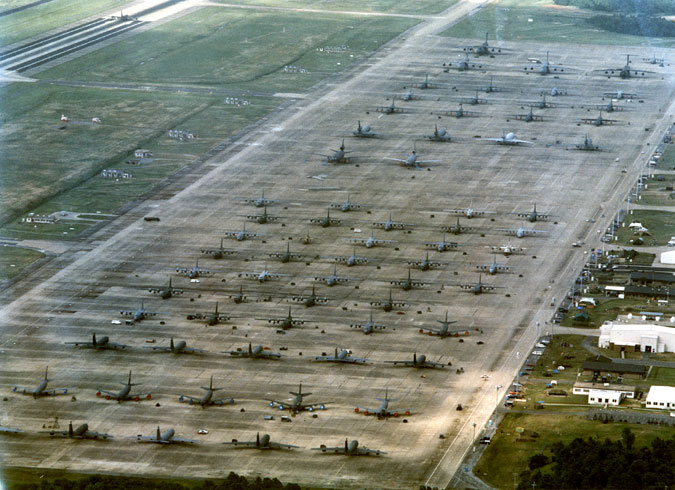 Aerial view of airplanes parked in multiple rows on base