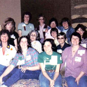 Group of white women in colorful clothing and name tags