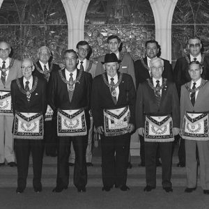 Group of white men posing in Masonic garb and suits