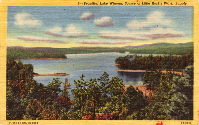 Postcard featuring aerial view of a lake with trees and countryside