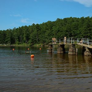 Lake with diving platform and orange buoys