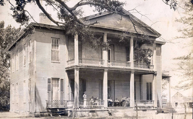 Two-story house with covered porch and balcony