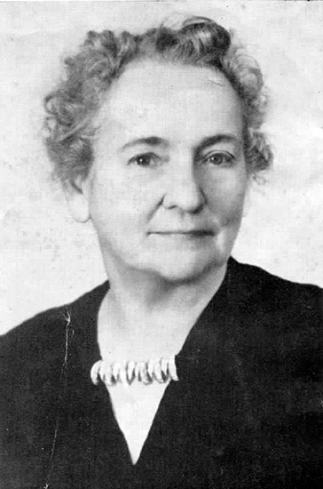 Older white woman with gray hair in black