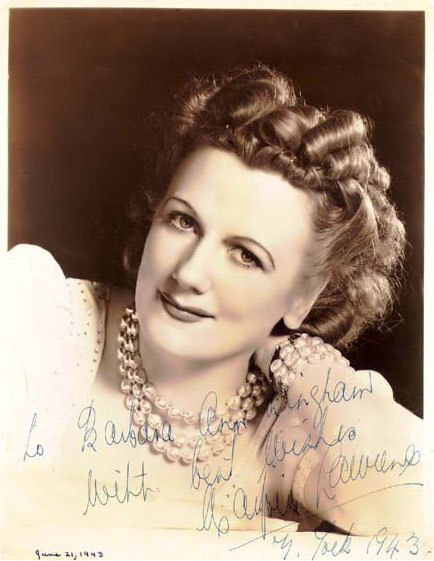 Hand signed portrait white woman smiling curled hair pearl necklace bracelet and blouse