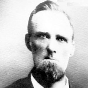 Old white man with beard in suit and tie