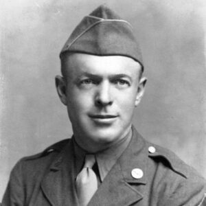 White clean-shaven man in military uniform with cap