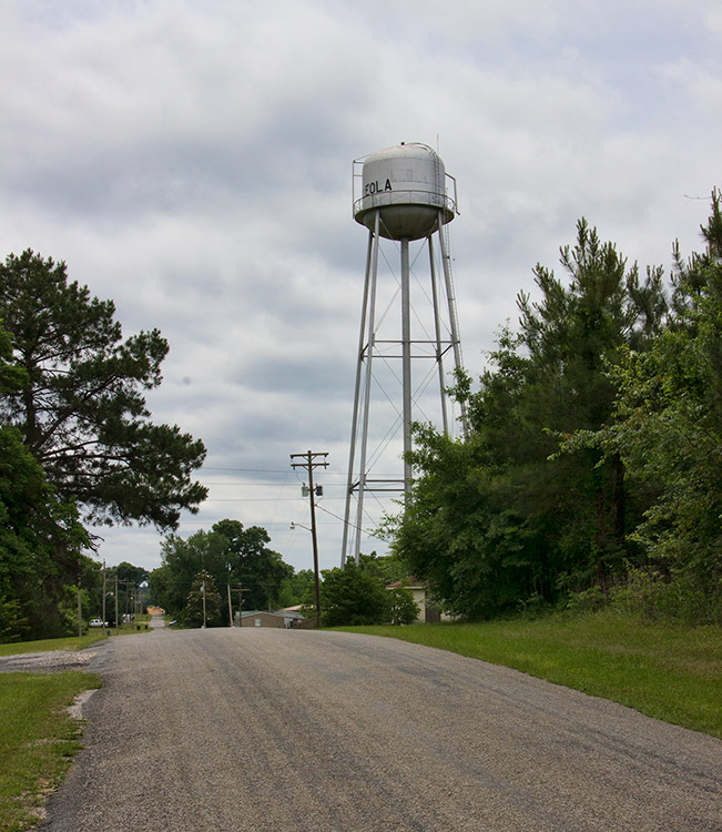 Rural road and buildings with water tower