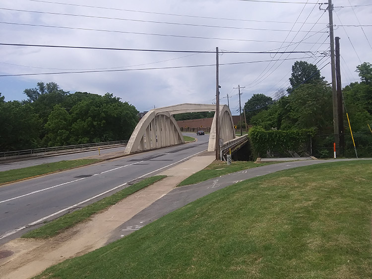 Concrete arch bridge on road