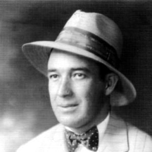 White man wearing a hat in suit and bow tie