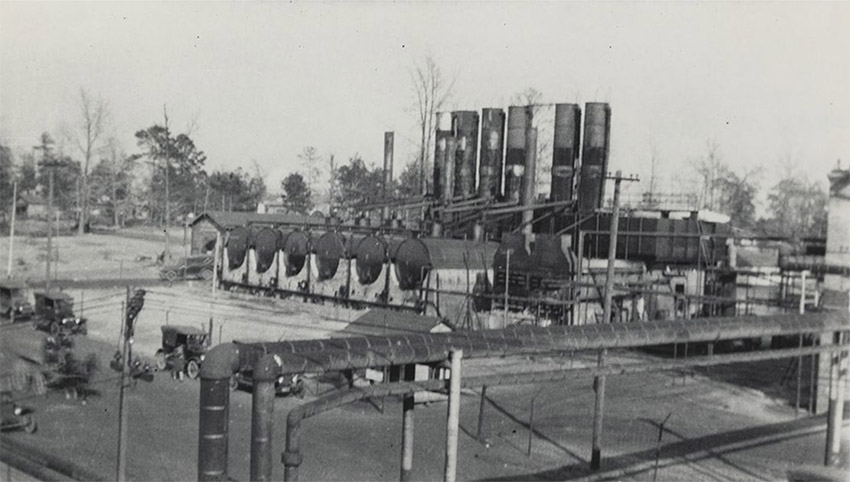 Industrial site with large pipes in foreground