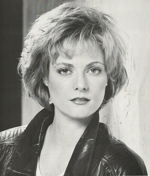Young white woman in black leather jacket