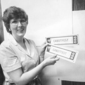 White woman holding Cabotfest materials