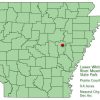Arkansas map with red dot in Prairie County and explanation in green text