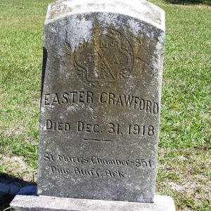Gravestone for "Easter Crawford" with carved M.T.A. Mosaic Templars of America emblem