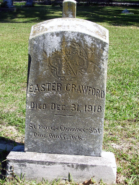 Gravestone for "Easter Crawford" with carved M.T.A. Mosaic Templars of America emblem