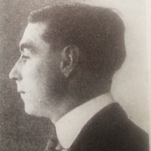 Profile view of white man in suit and tie