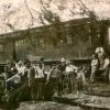 Group of white men with train cars
