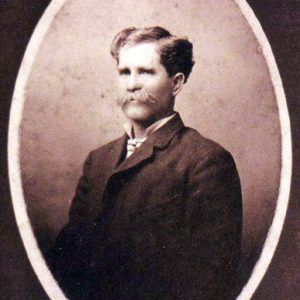 Portrait white man with mustache in suit